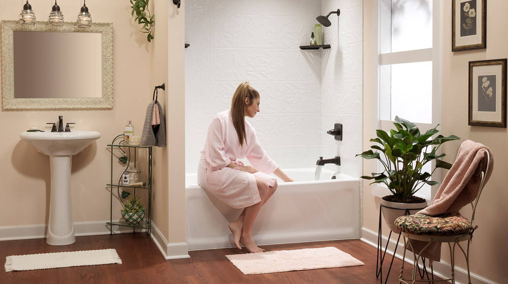 Modern blue house with large windows at dusk.