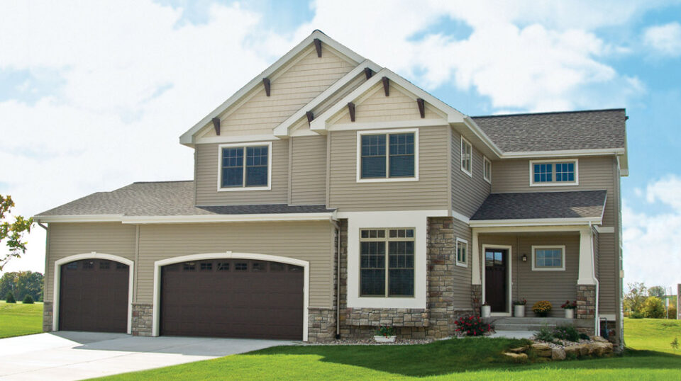 Modern suburban house with three-car garage.