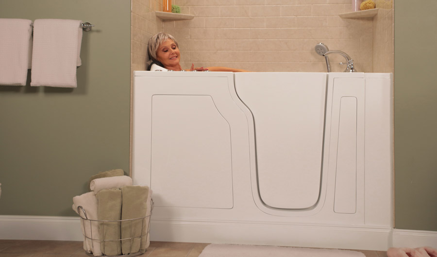 Elderly woman relaxing in a walk-in bathtub.